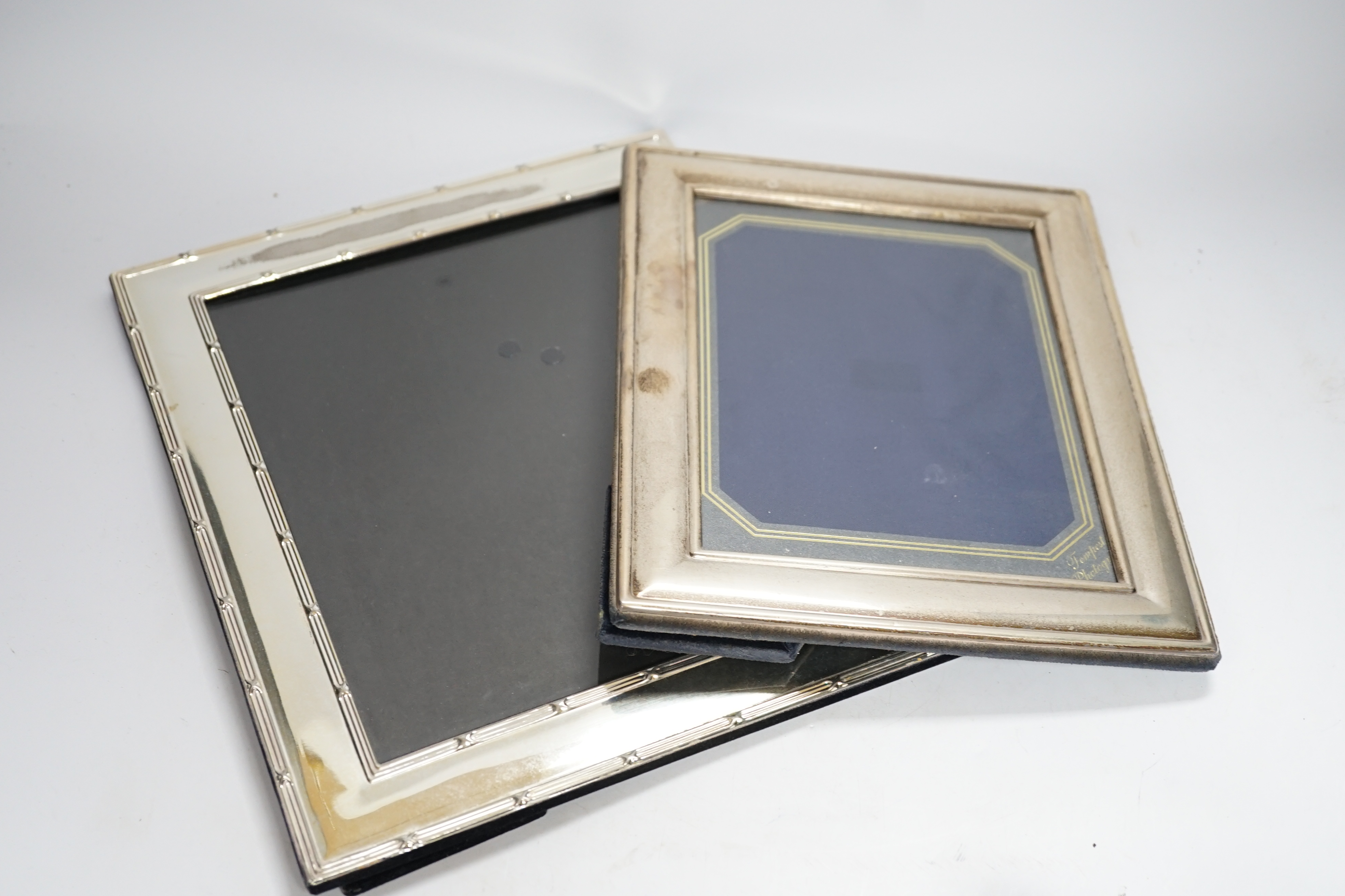Four assorted modern silver mounted photograph frames, largest 25.9cm and one silver plated photograph frame.